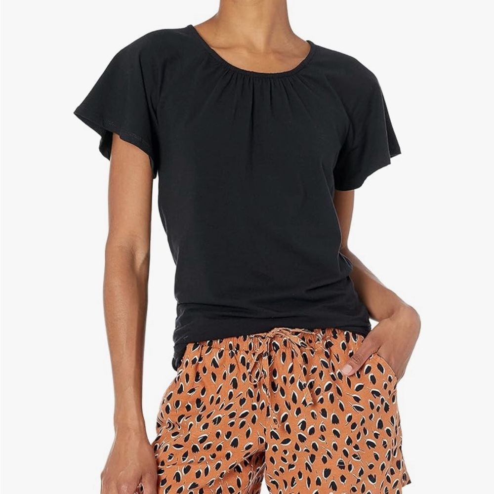 Cape sleeves and fitted black tee, buttons in back, dressy